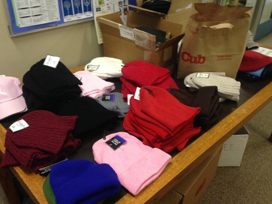 Donated hats at a table in the main office.