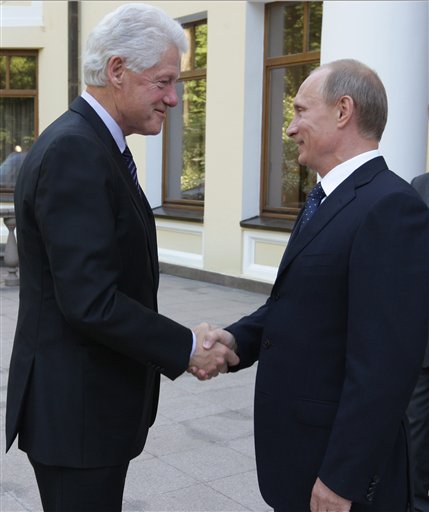 Russian Prime Minister Vladimir Putin, right, greets former U.S. President Bill Clinton in the Novo-Ogaryovo residence outside Moscow, Russia, Tuesday, June 29, 2010. (AP Photo/RIA-Novosti, Alexei Druzhinin, Pool)