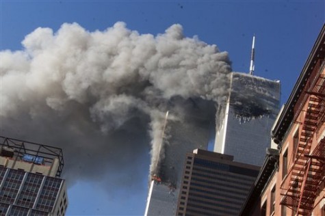 This Sept. 11, 2001 file photo shows smoke rising from the burning twin towers of the World Trade Center after hijacked planes crashed into the towers, in New York City. The U.S. government is aware of no credible or specific information that points to any terror plot tied to the anniversary of the September 2001 attacks, according to a new confidential threat assessment from the FBI and Homeland Security Department obtained by The Associated Press. (AP Photo/Richard Drew, File)