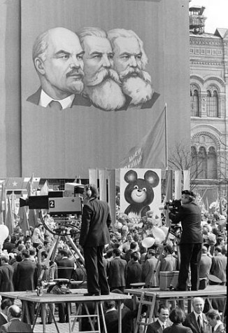 May Day activities in Red Square in Moscow are seen, with marchers carrying a picture of Mishka, symbol of the Moscow Olympics, May 1, 1980. Portraits of Lenin, Marx, and Engels are seen at top. (AP Photo/Boris Yurchenko)