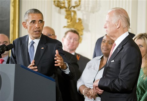 President Barack Obama, joined by Vice President Joe Biden and gun violence victims, speaks in the East Room of the White House in Washington, Tuesday, Jan. 5, 2016, about steps his administration is taking to reduce gun violence. Also on stage are stakeholders, and individuals whose lives have been impacted by the gun violence. (AP Photo/Pablo Martinez Monsivais)