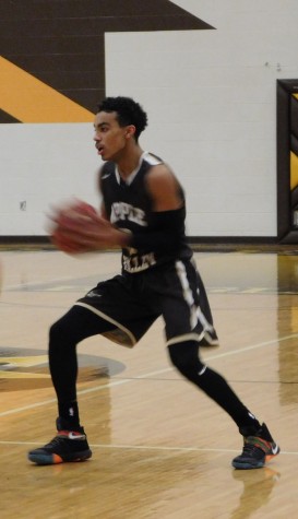 Apple Valley's Tre Jones makes a pass on Tuesday night. Jones recorded a double-double with 13 points and 10 assists.