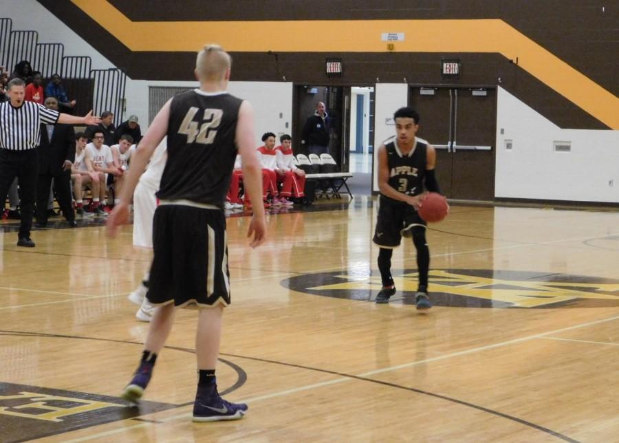 Tre Jones looks to pass to Miles Hendrickson.