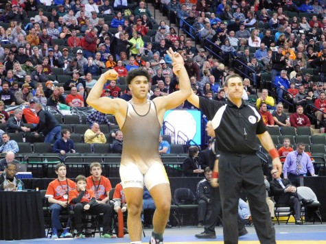 Gable Steveson celebrates after winning the state title at 220 pounds