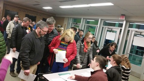 Voters wait in line to verify precinct assignments