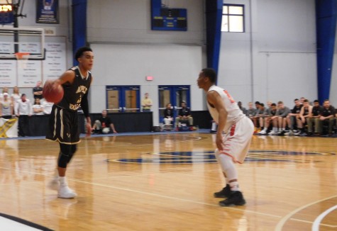 Tre Jones going up against an Osseo defender.