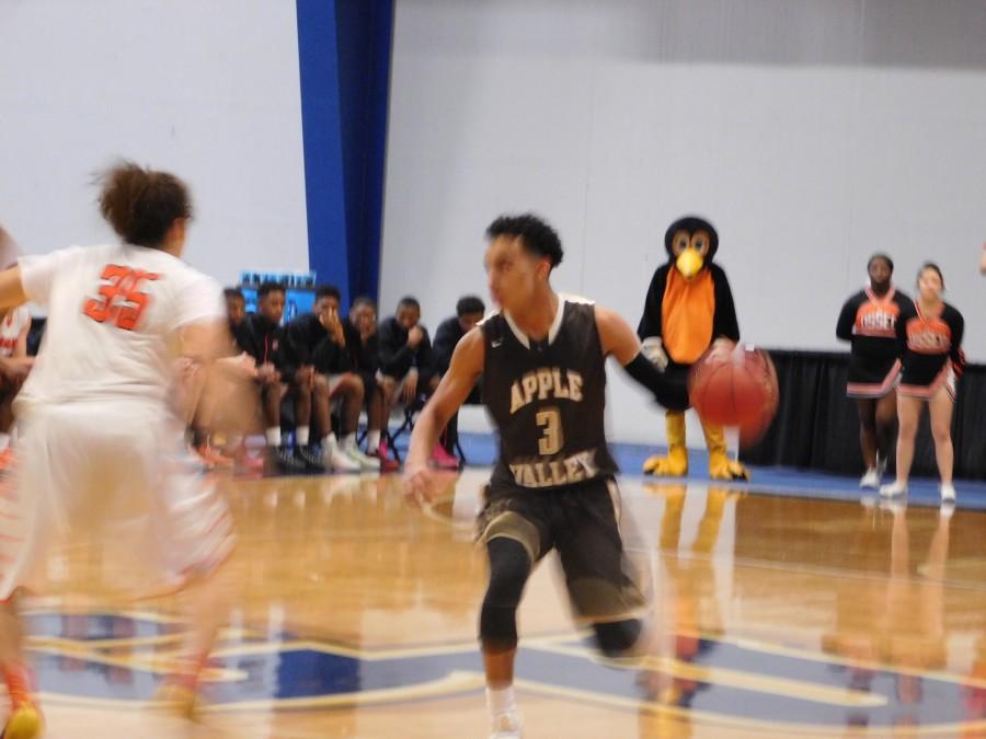 Tre Jones going up against an Osseo defender.