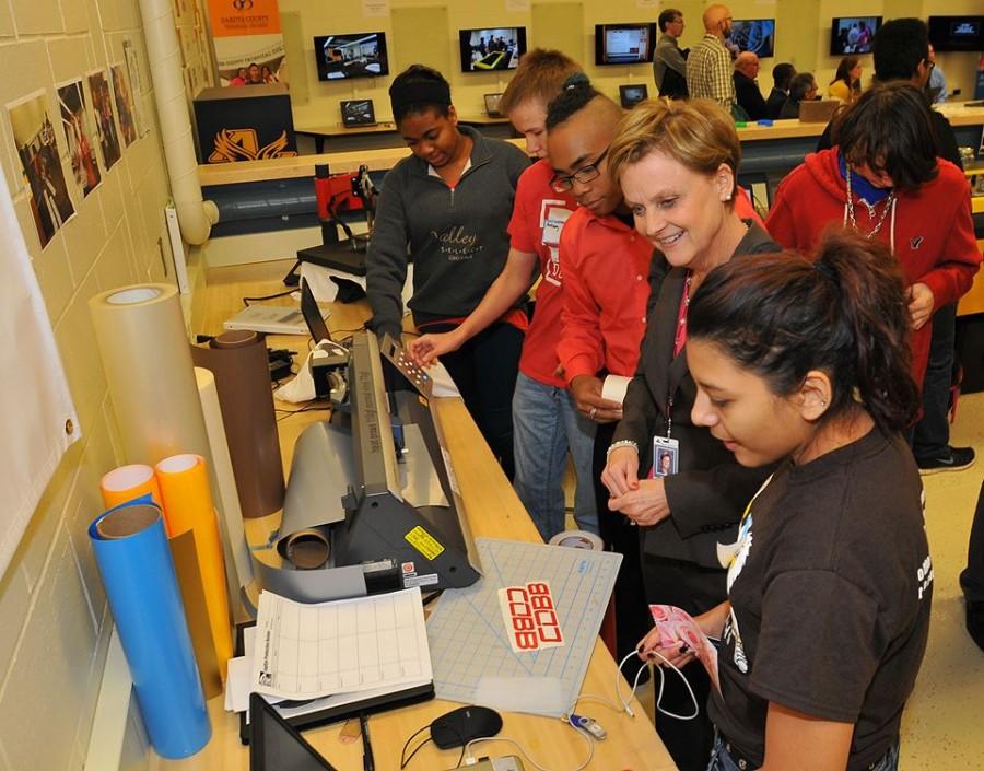 Students show Superintendent Berenz aspects of the Fab Lab.