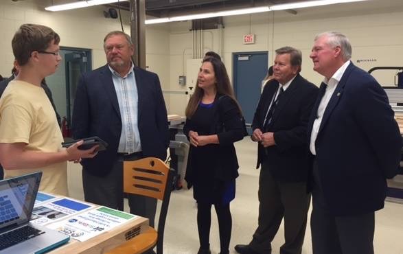 Mr. Degenaar and Apple Valley community members visit the Fab Lab.