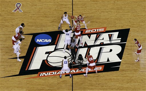 Duke's Jahlil Okafor (15) and Wisconsin's Frank Kaminsky (44) battle for the ball at the tip off during the first half of the NCAA Final Four college basketball tournament championship game Monday, April 6, 2015, in Indianapolis.