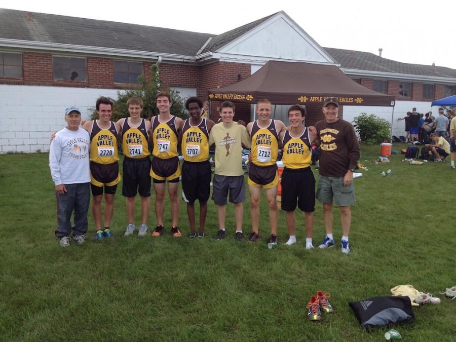 Coach Greeno (right) with some AVXC runners and Coach Wasmund (left)