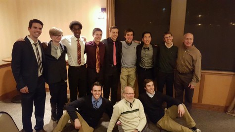 Greeno poses with his seniors and coaches at the 2015 cross country banquet.