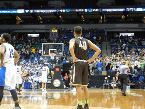 Cameron Kirksey looks on as Hopkins attempts a free throw.