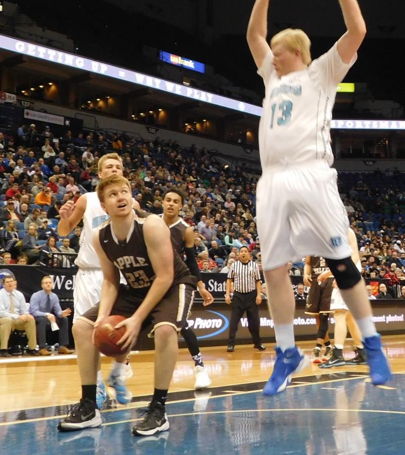 Apple Valley forward Aaron Ertz attempts to draw a foul against Blaine