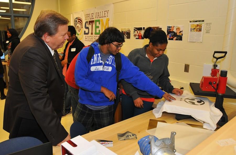 Mr. Degenaar observes students creating in the Fab Lab.