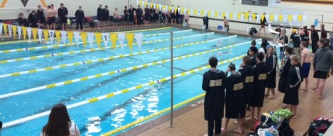 Swimmers gather together before a race.