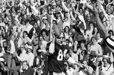 Pittsburgh Steelers tight end Randy Grossman (84) holds football in air after he took short pass from Terry Bradshaw to score in first quarter of Super Bowl X, against Dallas.