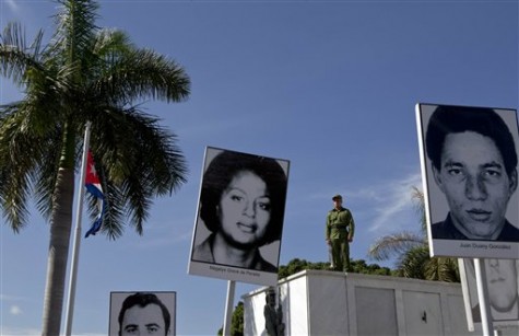 A memorial stands showing the faces of those who died on Cubana Airline Flight 455, during a ceremony marking the 38th anniversary of the mid-air bombing, at the Colon Cemetery in Havana, Cuba, Monday, Oct. 6, 2014. 