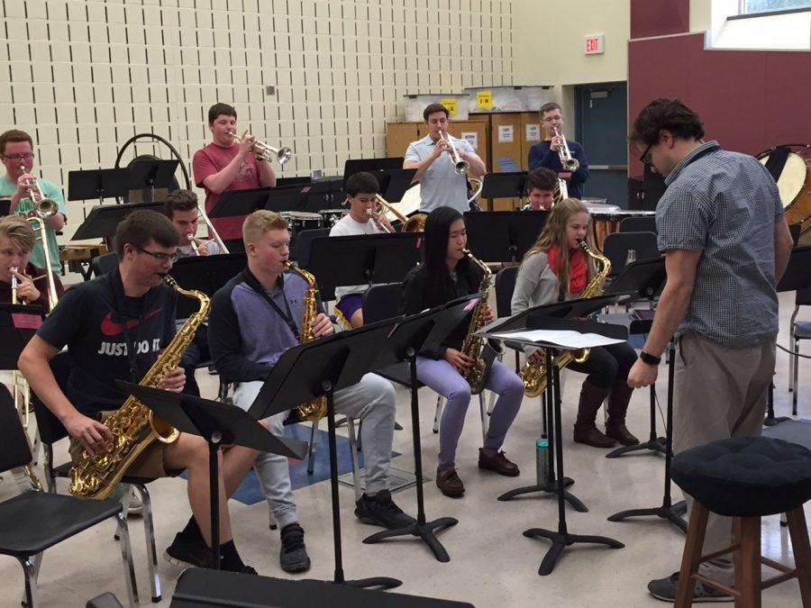 Mr. Scalise rehearses with band students after school.