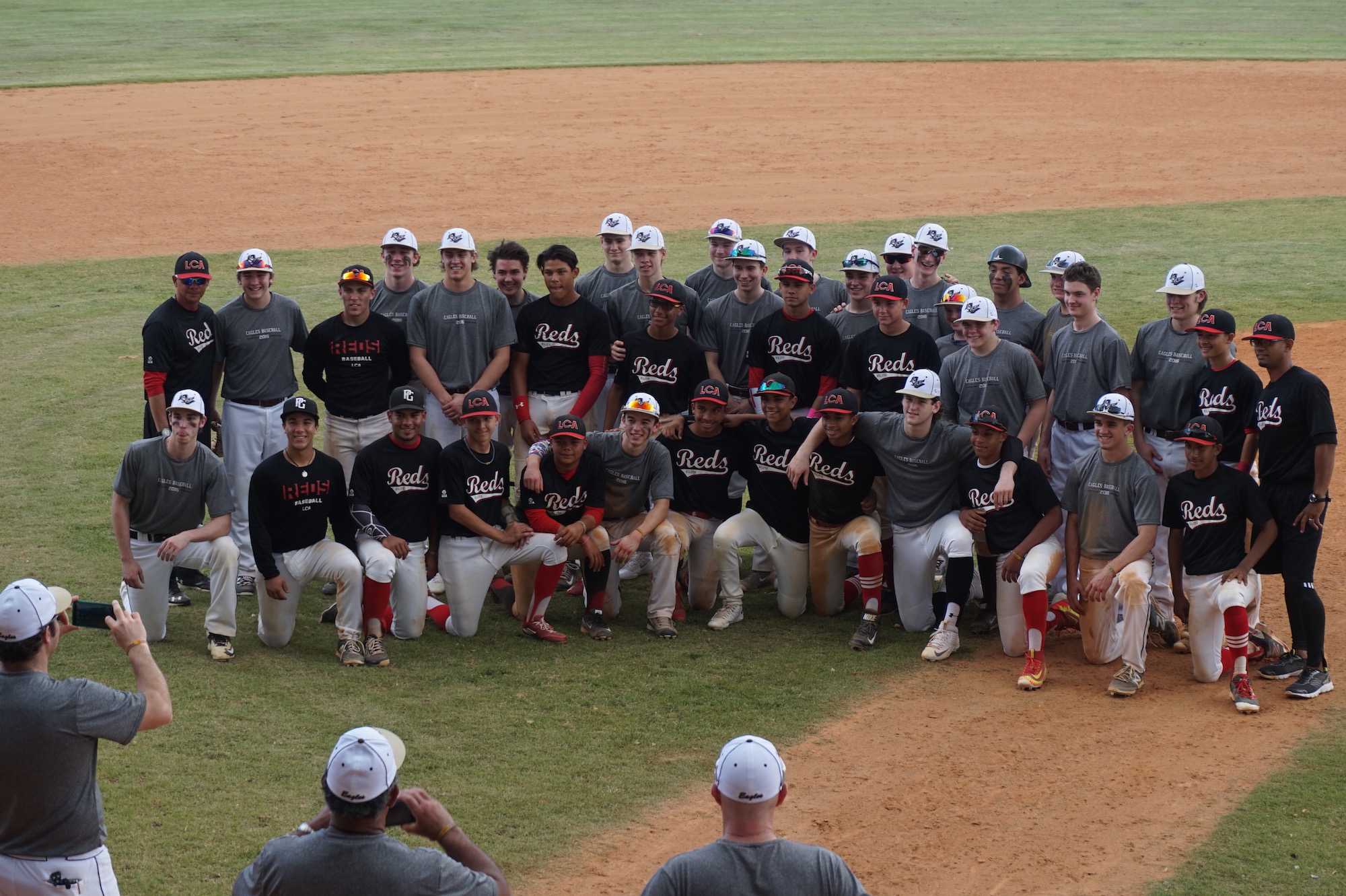 The Eagles and the Reds coming together for a picture following the first of 5 scrimmages in Puerto Rico