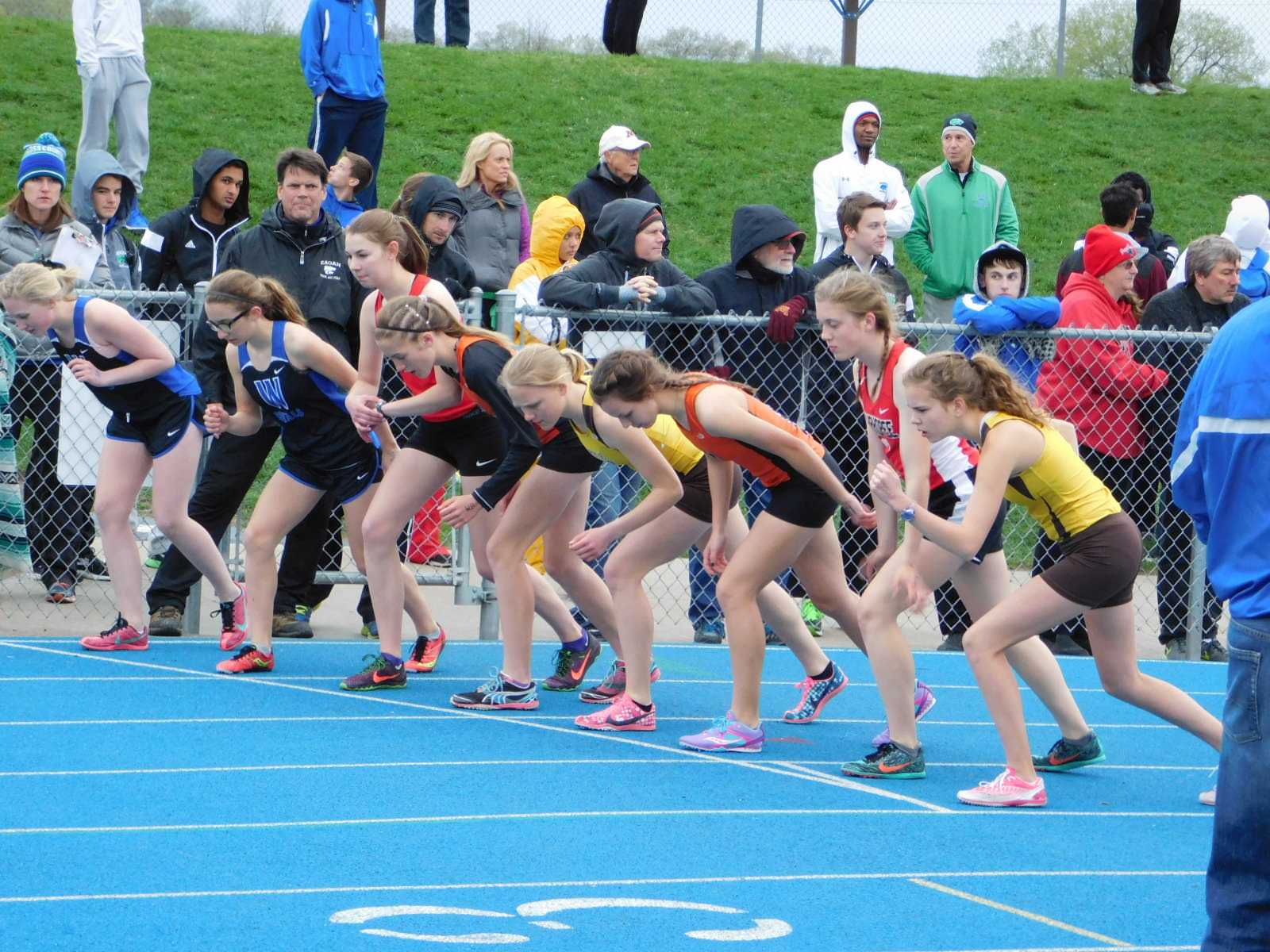 3200 meter runners line up for the race.  From left to right for Apple Valley- Morgan Meyer, Hallie Hughes