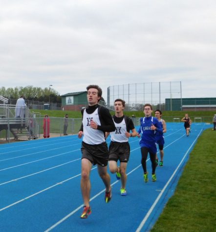 Robert Hapke(front) and Michael Boerboon(back) fend off Eagan competitors in the 3200 meter race