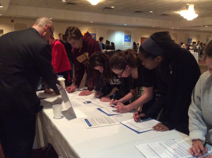 Students work through a station at the Reality Fair.