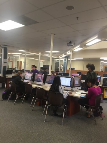 Students in the media center using the computers