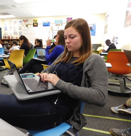 Senior Kayla Kirtz and classmates work on their research papers in the new swivel desks. 