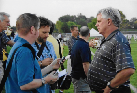 Coach Chuck Scanlon talking to reporters after a home game win.