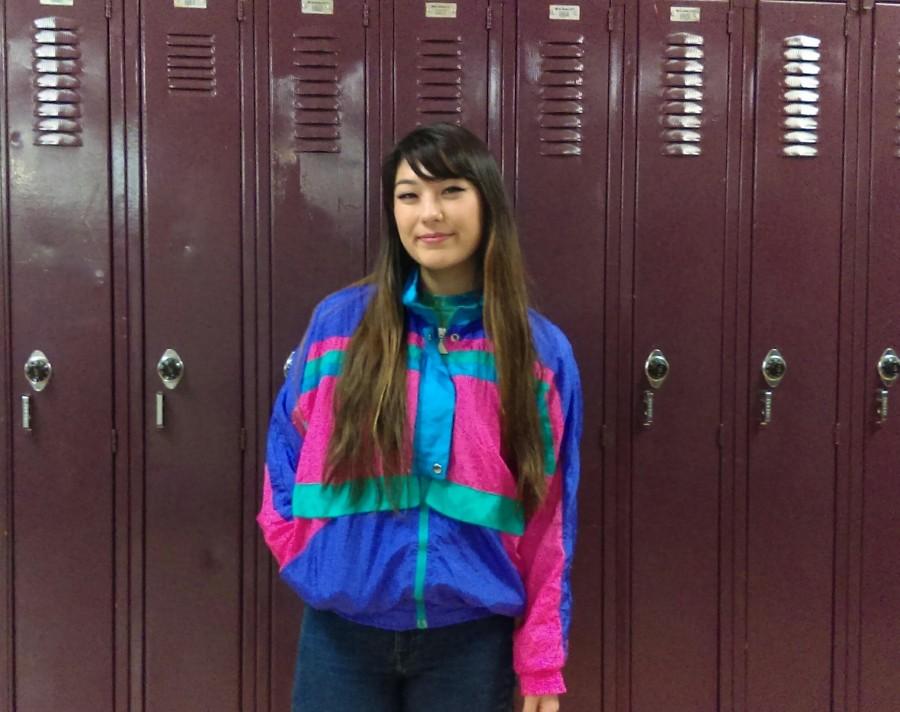 Senior Emily Cloud sporting a neon windbreaker - iconic 90's wear. 