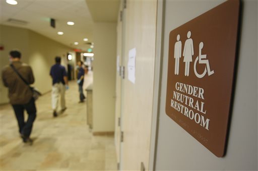 In this Aug. 23, 2007 file photo, a sign marks the entrance to a gender neutral restroom  at the University of Vermont in Burlington, Vt. For opponents of transgender rights, a favorite line of attack is to oppose policies that would allow people to choose whether to use a men's or women's bathroom based on gender identity.