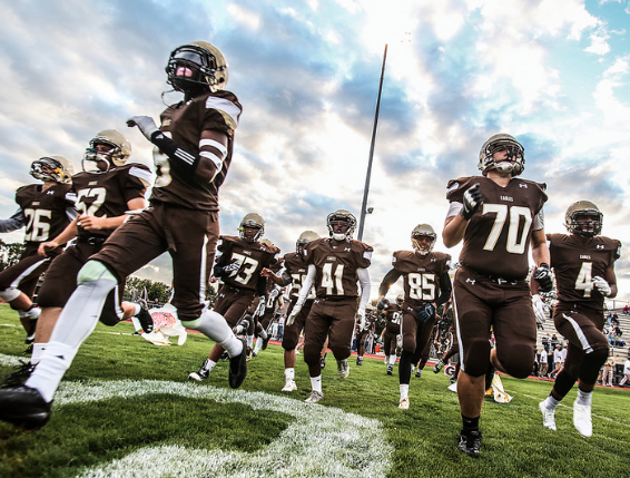 The Eagles running onto the field