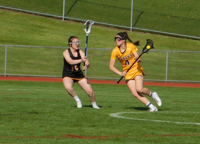 Captain Katie Moynihan drives to the net. She finished the game with five goals.