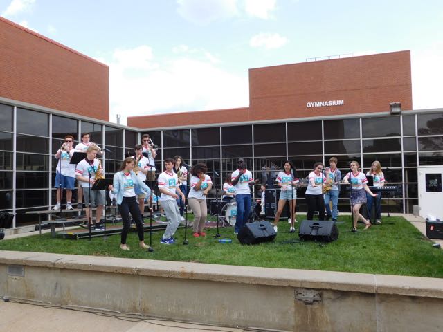 The R&B band rocks out in the courtyard after school.