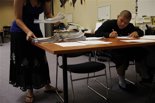 In this July 21, 2010 photo, Angel Cruz, 16, studies English at Learning Works! Charter School in Pasadena, Calif. The school was founded two years ago by Mikala Rahn to serve Pasadenas highest risk youth, gangbangers, teen mothers, parolees, with one goal in mind, to get them to graduate high school. The school employees "chasers" to round up students, covering every excuse they use to not attend school. They will bring them to school, take them to planned parenthood appointments, to see parents in jail, to attend court hearings and even pick them up from juvenile hall and police stations. (AP Photo/Jae C. Hong)