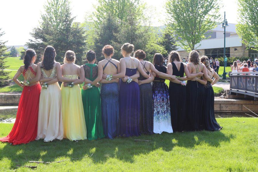 A group of girls and their colorful dresses.