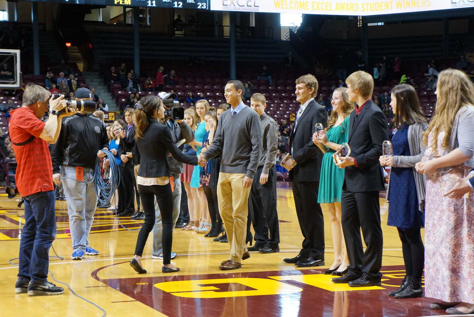 Ethan accepting the Excel award.