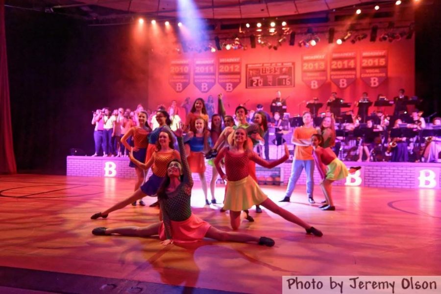 Broadway dancers strike a pose at the end of a song. 