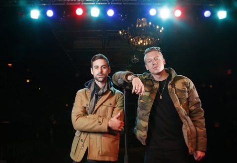 FILE - In this Nov. 20, 2012 file photo, American musician Ben Haggerty, better known by his stage name Macklemore, right, and his producer Ryan Lewis pose for a portrait at Irving Plaza in New York. Macklemore & Ryan Lewis are top contenders at the Grammy Awards on Sunday, Jan. 26, 2014, with seven nominations, including best new artist and song of the year for Same Love. Their debut album, The Heist, is up for album of the year and best rap album, while the massive hit Thrift Shop is nominated for best rap song and rap performance. The duos other hit, Cant Hold Us, will compete for best music video. (Photo by Carlo Allegri/Invision/AP, File)