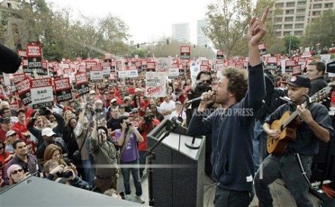 Members of Rage Against The Machine perform at a strike by the Writers Guild of America