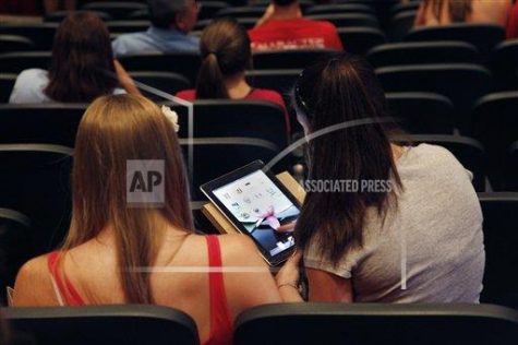 Students using iPads in their schools (AP Photo/Elise Amendola)