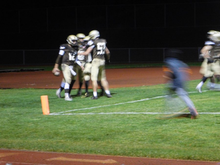 Noah Sanders celebrates a rushing touchdown.