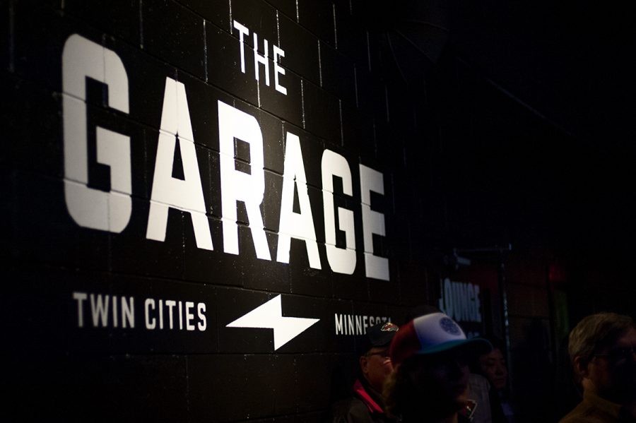 The Garage's logo on a wall near the stage.