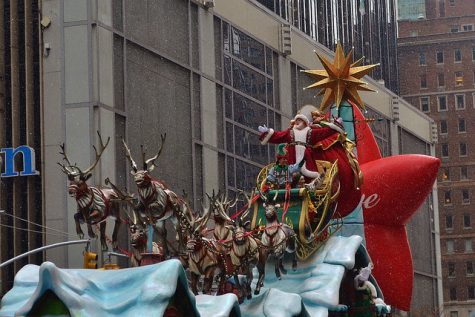 Santa and his reindeer bring up the rear, ringing in the Christmas season.