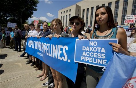 Actress Shailene Woodley, fourth from right to right, Riley Keough the eldest grandchild of Elvis and Priscilla Presley, actress Susan Sarandon and Standing Rock Sioux Tribe member Bobbi Jean Three Lakes, right, participate in a rally outside the US District Court in Washington, Wednesday, Aug. 24, 2016, in solidarity with the Standing Rock Sioux Tribe in their lawsuit against the Army Corps of Engineers to protect their water and land from the Dakota Access Pipeline. A federal judge in Washington considered a request by the Standing Rock Sioux for a temporary injunction against an oil pipeline under construction near their reservation straddling the North Dakota-South Dakota border. (AP Photo/Manuel Balce Ceneta)