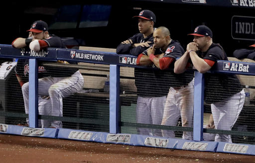 Cleveland Indians watch the Chicago Cubs celebrate after Game 7 of the Major League Baseball World Series Thursday, Nov. 3, 2016, in Cleveland. The Cubs won 8-7 in 10 innings to win the series 4-3. (AP Photo/Charlie Riedel)