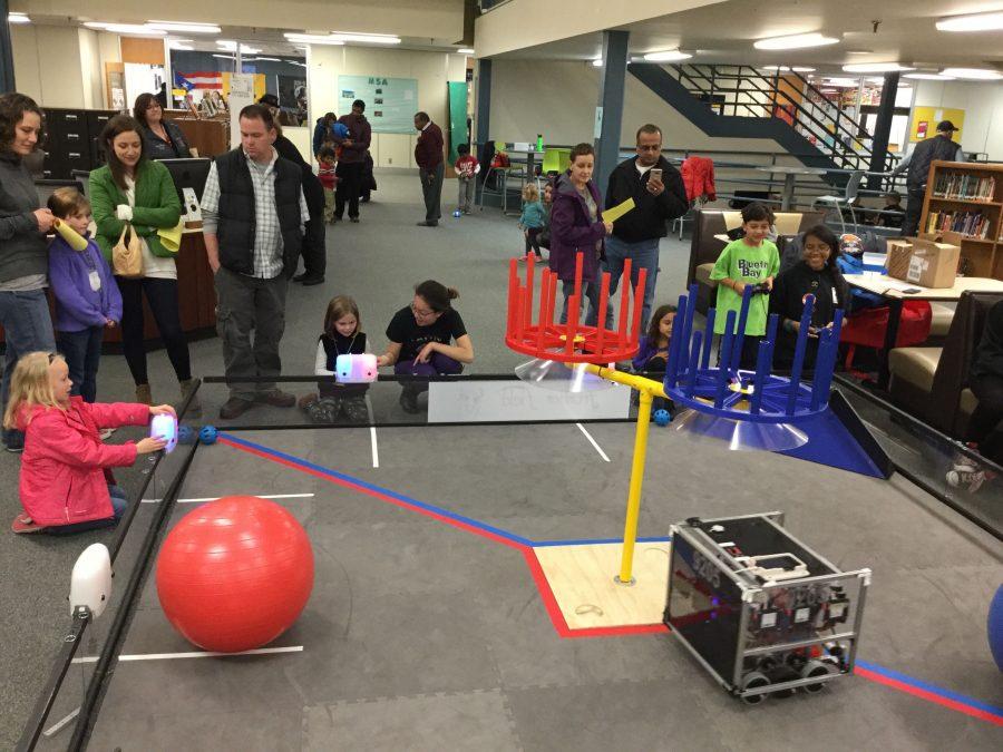 The Iron Maidens lead an interactive robot activity.