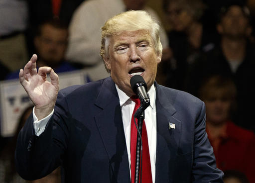 In this Thursday, Dec. 1, 2016 file photo, U.S. President-elect Donald Trump speaks during a "USA Thank You" tour event in Cincinnati.  A spokeswoman for producer Mark Burnett said Thursday, Dec. 8, 2016, that President-elect Trump has an executive producer credit on "The New Celebrity Apprentice." The series, which was taped last February, debuts Jan. 2 with Arnold Schwarzenegger replacing Trump as host.