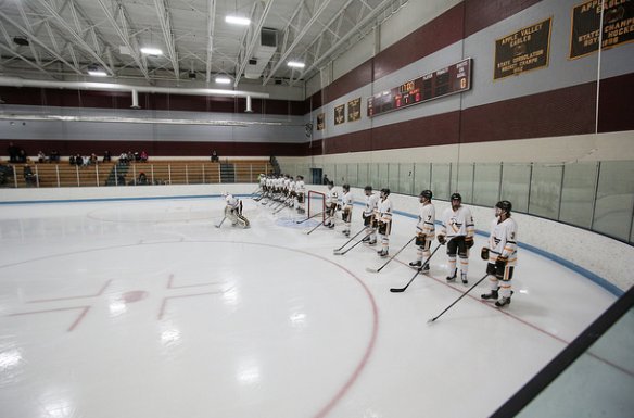 The boys hockey team lined up for the national anthem before their game against Park.